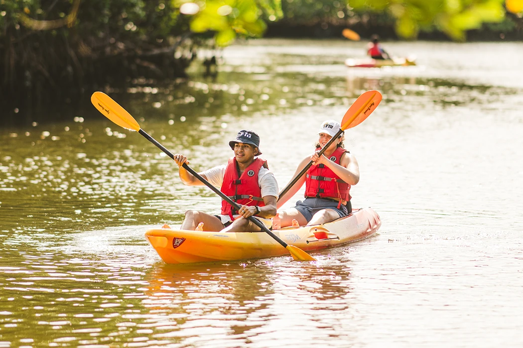 Two students kayaking in the bay at BBC.