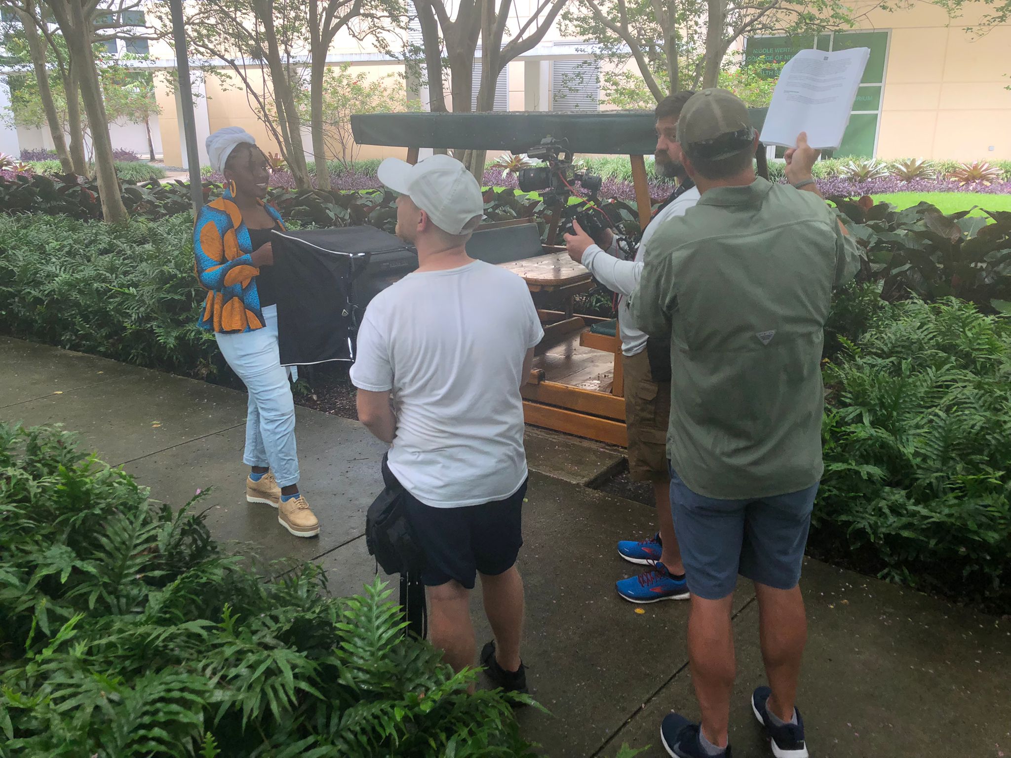 D’andria Hollins films her segment at the courtyard outside of Academic Health Center 3.