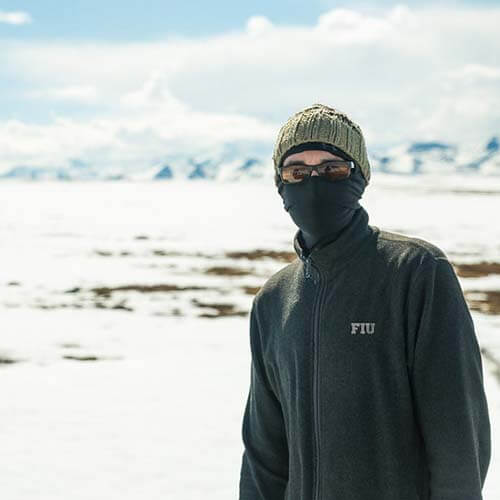 An FIU student in the Arctic conducting research