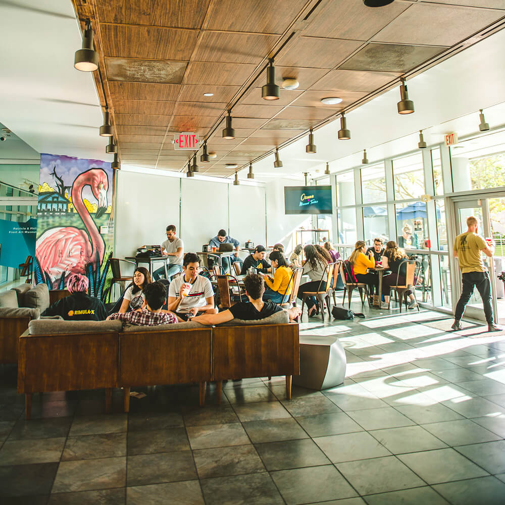 FIU students, faculty, staff and the community eating or drinking coffee at Vicky Bakery located inside the Frost Art Museum