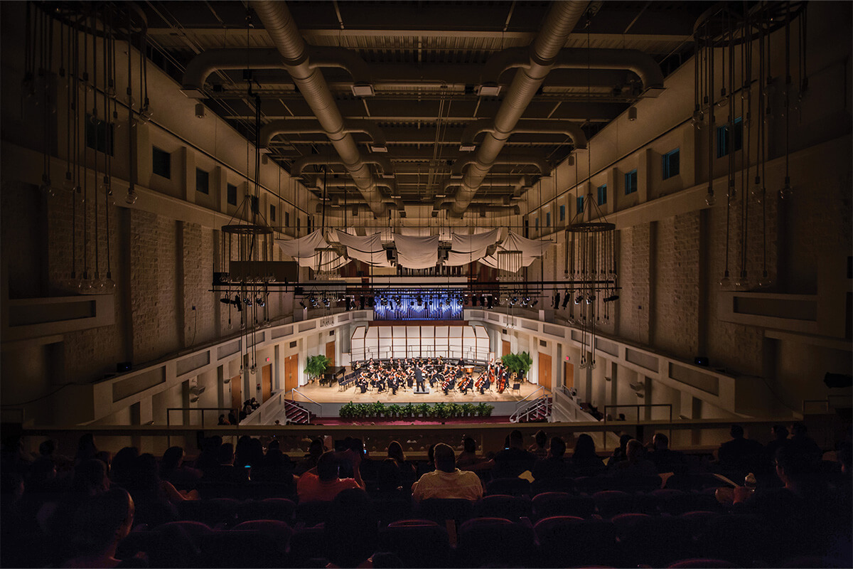 A wide angle shot of the 585-seat concert hall, Wertheim Performing Arts Center. 